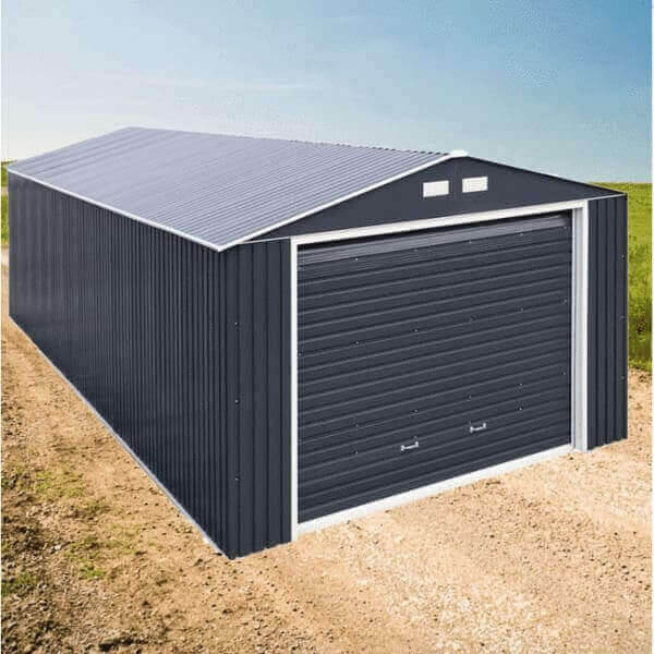 Imperial Metal Garage kit by Duramax on a gravel path, featuring a sleek design and spacious roll-up door.