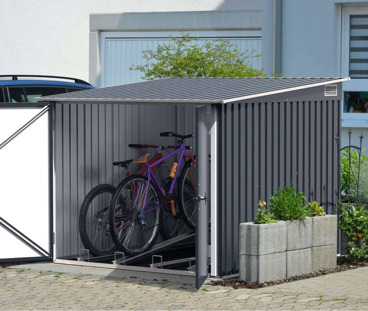 Durable Duramax metal shed storing bicycles, featuring a modern design and ample space for outdoor equipment.