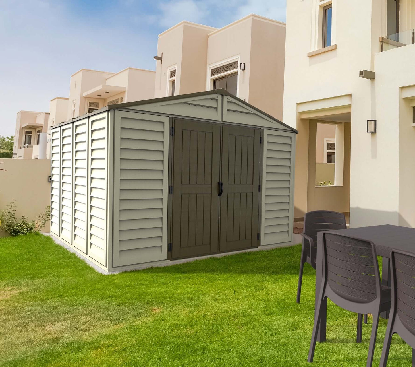 Duramax 10.5x10.5 Woodbridge PLUS Vinyl Shed with foundation in backyard setting.