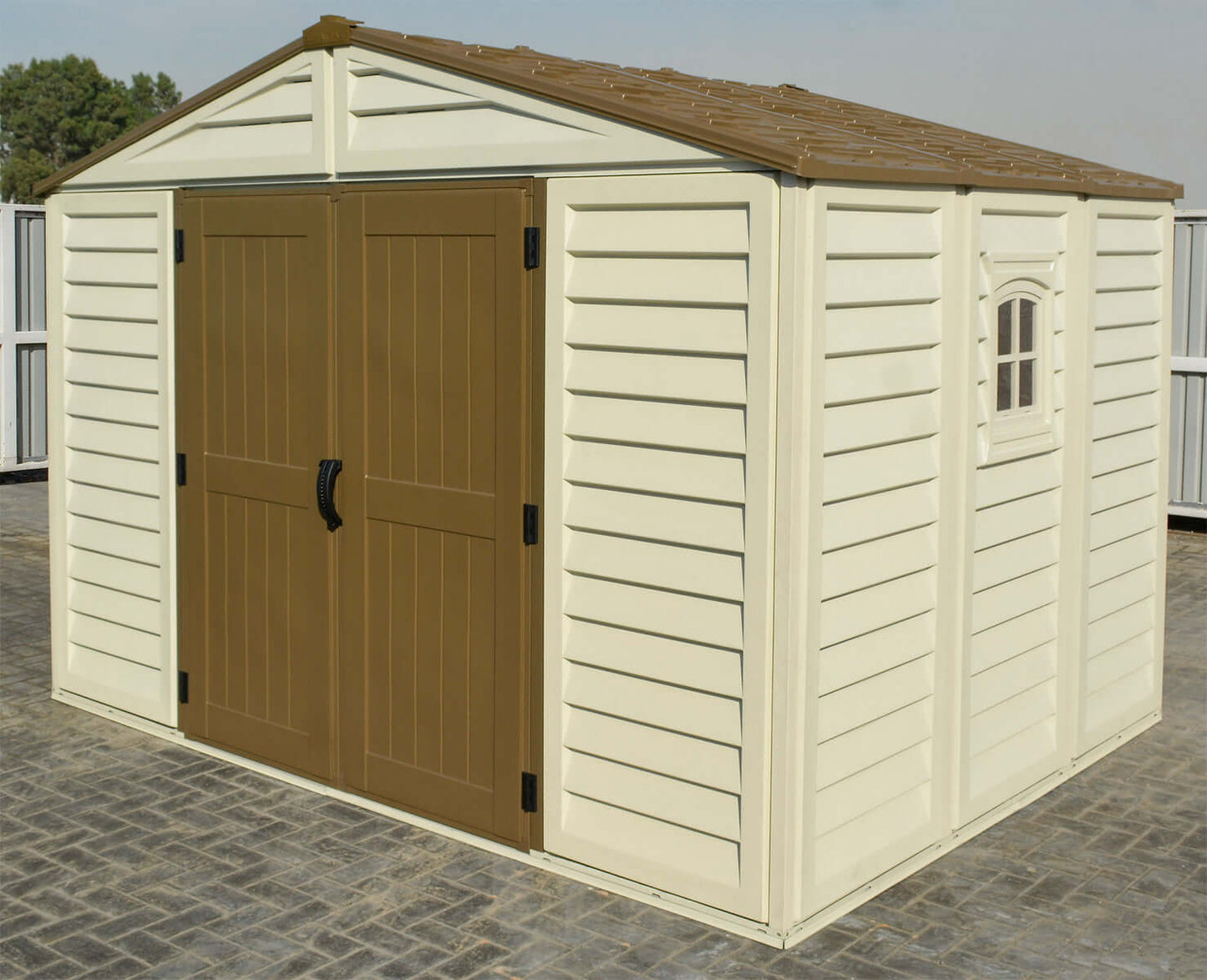 Duramax 10.5x8 Woodbridge PLUS Vinyl Shed with Foundation in outdoor setting. Durable weather-resistant design. Keywords: Duramax shed.