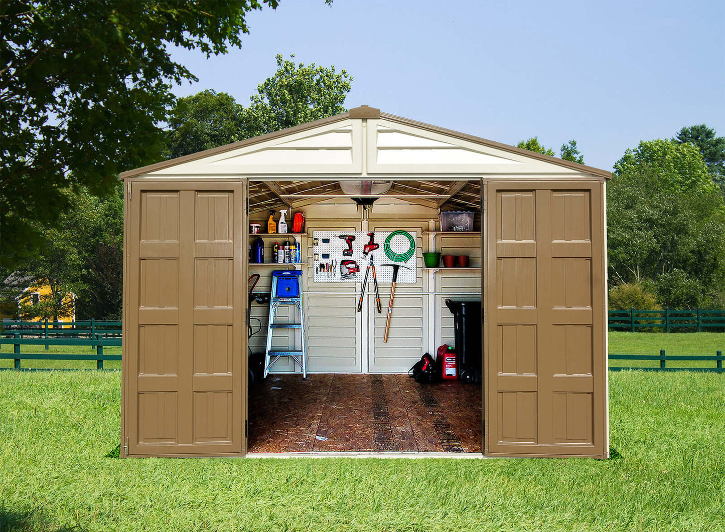 Duramax 10.5x8 Woodbridge PLUS vinyl shed with open double doors, showcasing interior storage space and organized tools.
