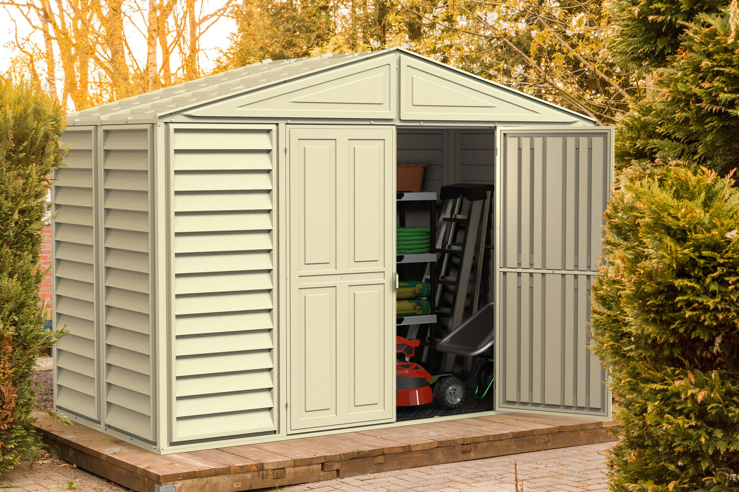 Duramax 10x5 WoodBridge Vinyl Shed with open doors showing stored tools and equipment, ideal for outdoor storage solutions.