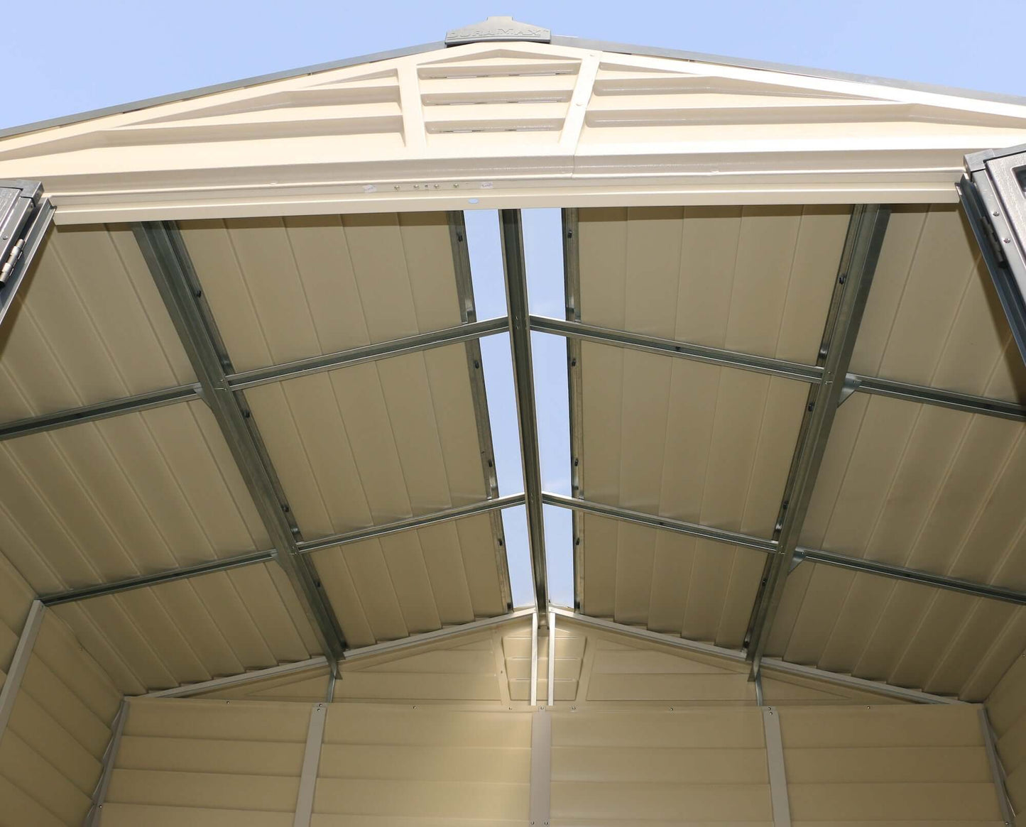 Interior view of Duramax 10x8 StoreMax PLUS Vinyl Shed roof showing skylight and structural support