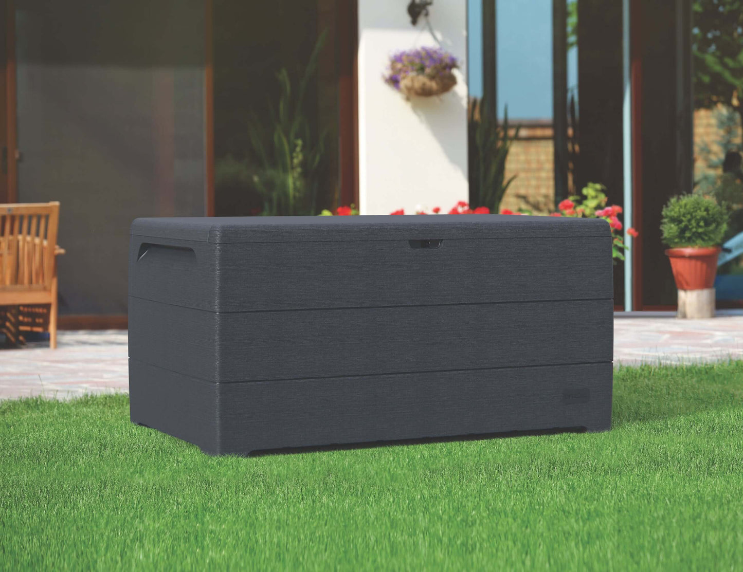 Duramax 110 Gal. Cedar Grain Deck Box in gray on a lawn, showcasing its large storage capacity and stylish outdoor design.