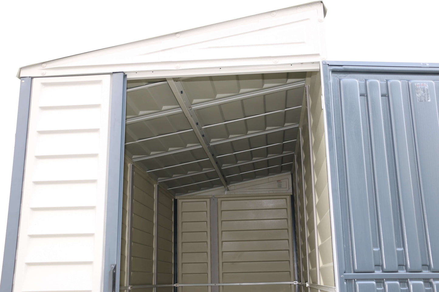 Inside view of Duramax SideMate PLUS 4x10 vinyl shed with open door showcasing durable grey all-weather construction.