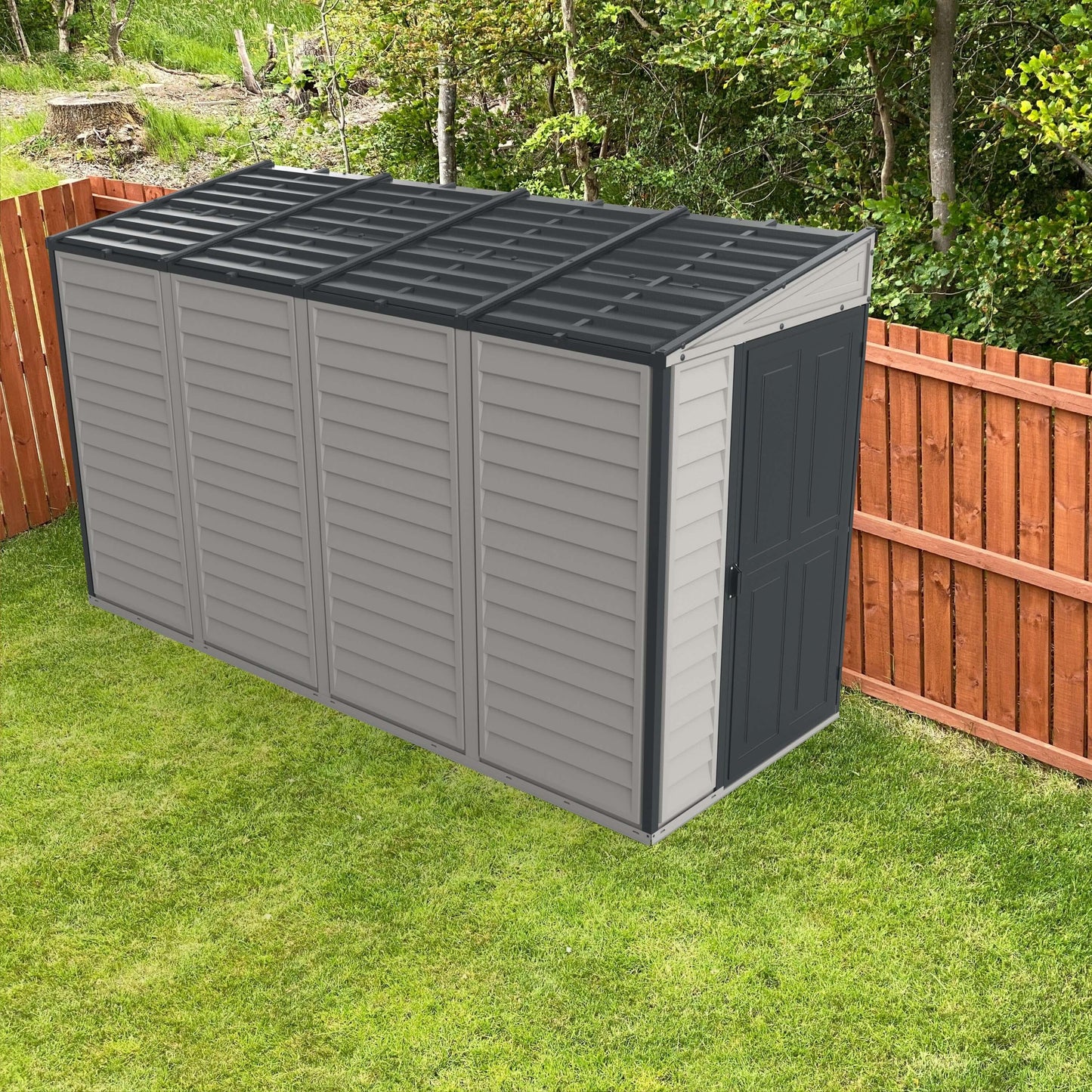 Duramax SideMate PLUS 4x10 vinyl shed with foundation, sleek grey finish, placed beside a wooden fence, ideal for garden storage.