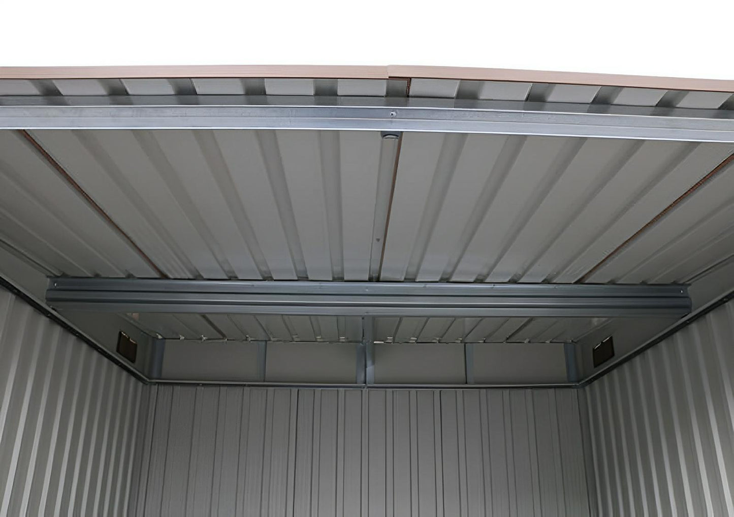 Interior view of Duramax 6x6 bike shed roof and walls, showing metal construction and robust design for secure storage. Keywords: duramax sheds.