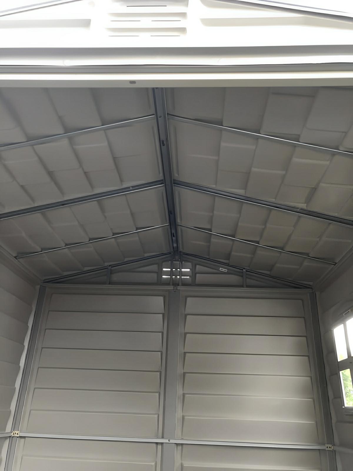 Interior view of Duramax 6x6 StoreMate PLUS vinyl shed with galvanized steel beams for durability and security.