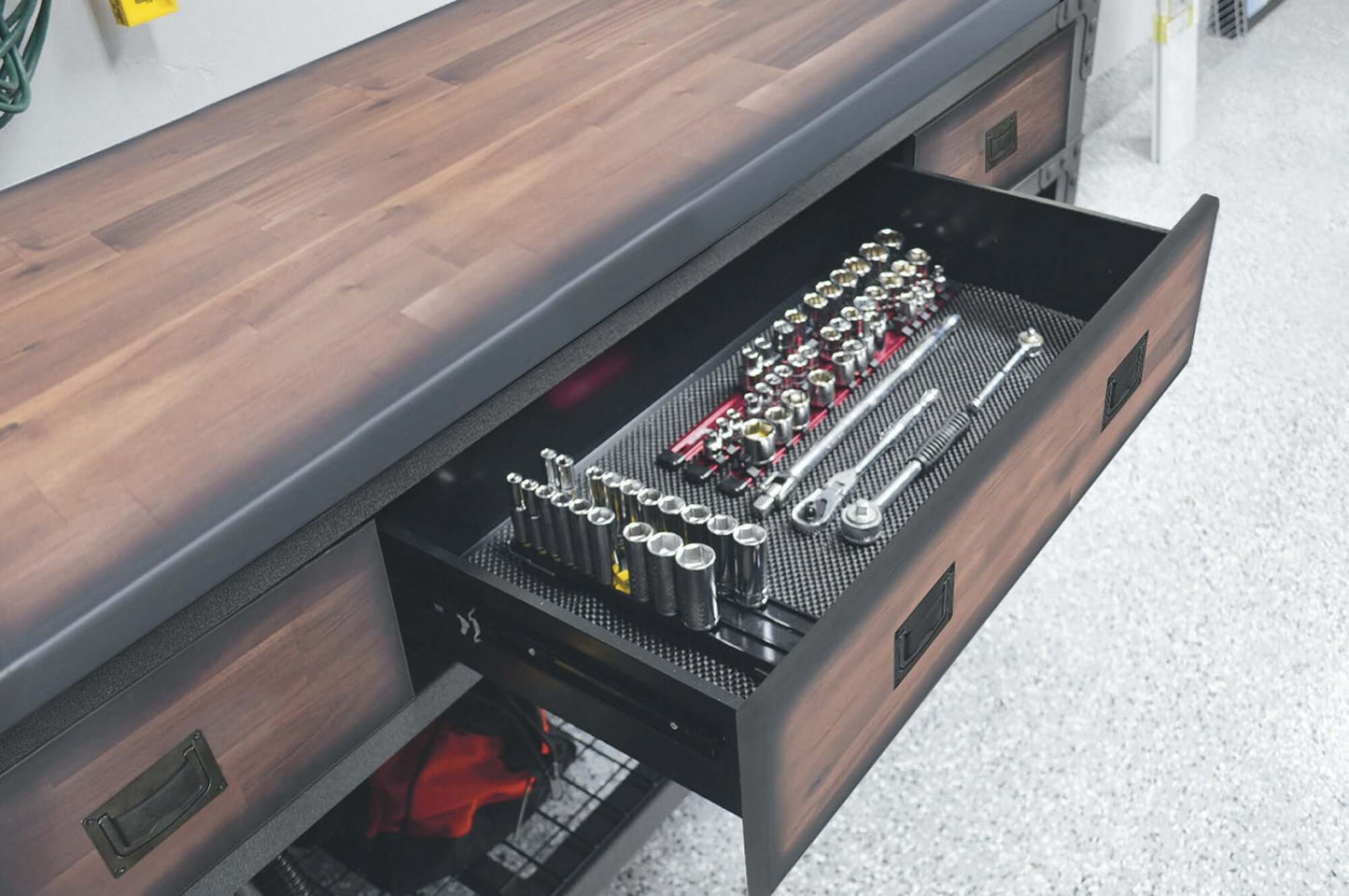 Open drawer of Duramax 72x24 inch rolling workbench displaying organized tools on a rubberwood countertop.
