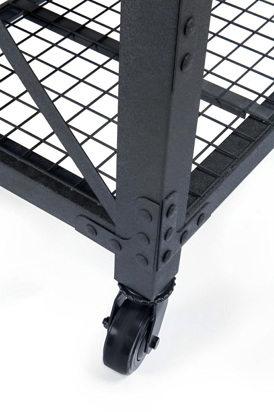 Close-up of industrial workbench's sturdy steel frame and caster wheel for mobility.