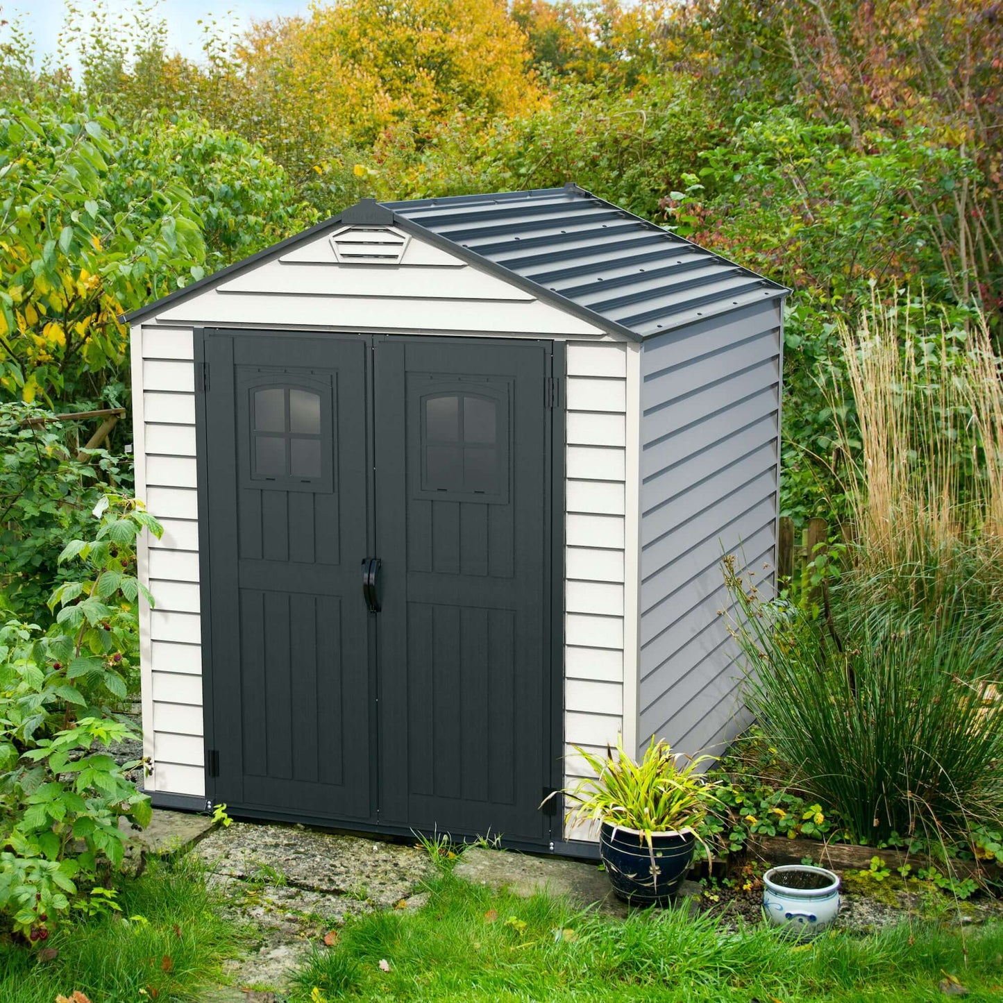 Duramax 7x7 StoreMax PLUS Vinyl Shed with robust design, featuring fire-retardant vinyl and galvanized steel supports.