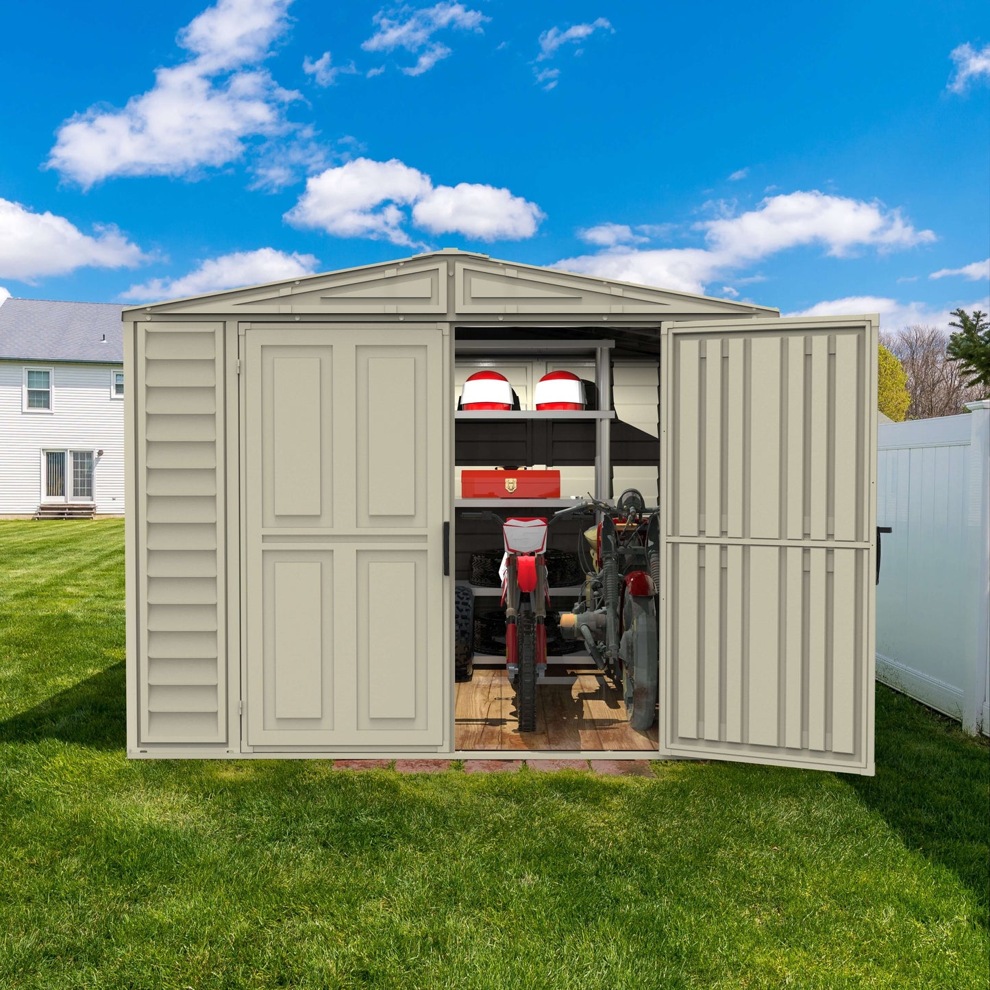 Duramax 8x8 DuraMate Vinyl Shed with Foundation showing spacious, open doors and sturdy metal-reinforced walls in a backyard.