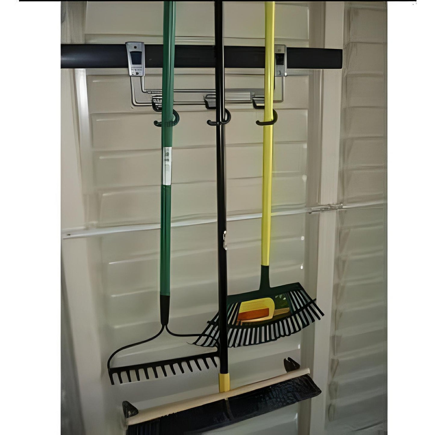 Duramax Building Products multi-purpose hook with tools hanging in a vinyl shed panel for enhanced storage from Duramax Sheds Online.