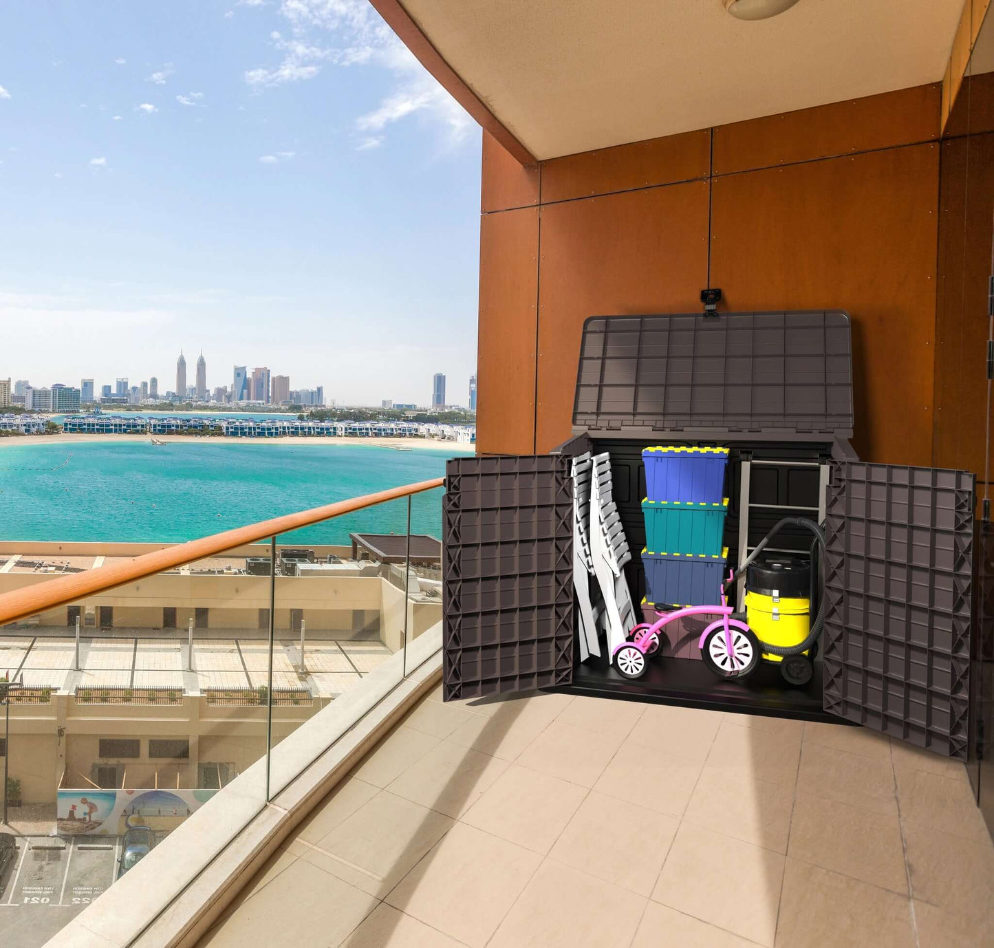 Duramax Storeaway 850L garden shed on a balcony storing tools and toys with a cityscape in the background.