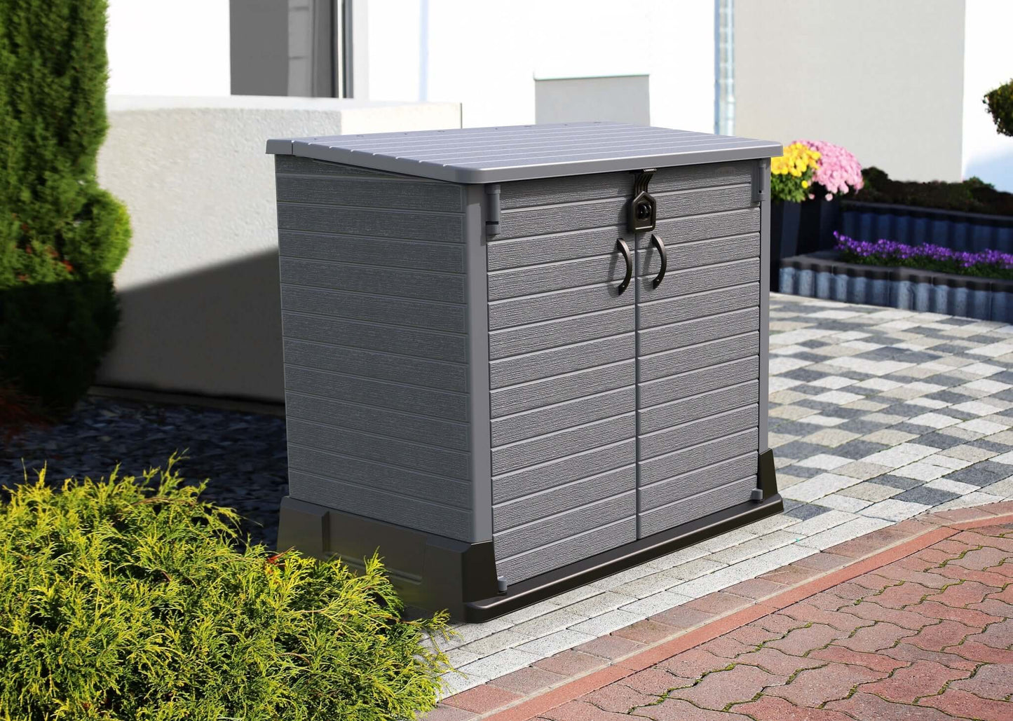 Gray Duramax Storeaway 850L garden shed with wide-opening doors on a patio, ideal for outdoor storage of tools and equipment.