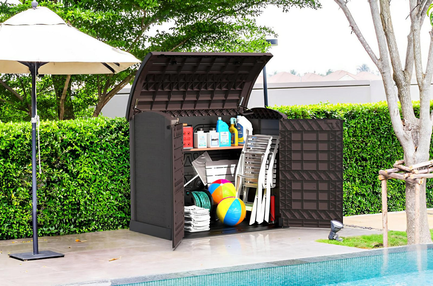 Duramax Storeaway Arc Lid 1200L garden shed storing outdoor items like tools and bikes, brown weatherproof design by poolside.