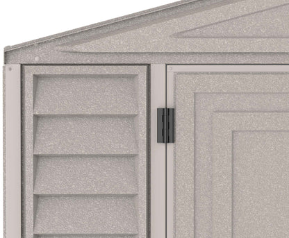 Close-up of Duramax vinyl garage corner showing texture and door hinge detail.