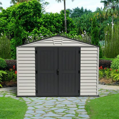 Duramax 10x8 StoreMax PLUS Vinyl Shed with floor in a garden setting, showcasing durable, all-weather construction.