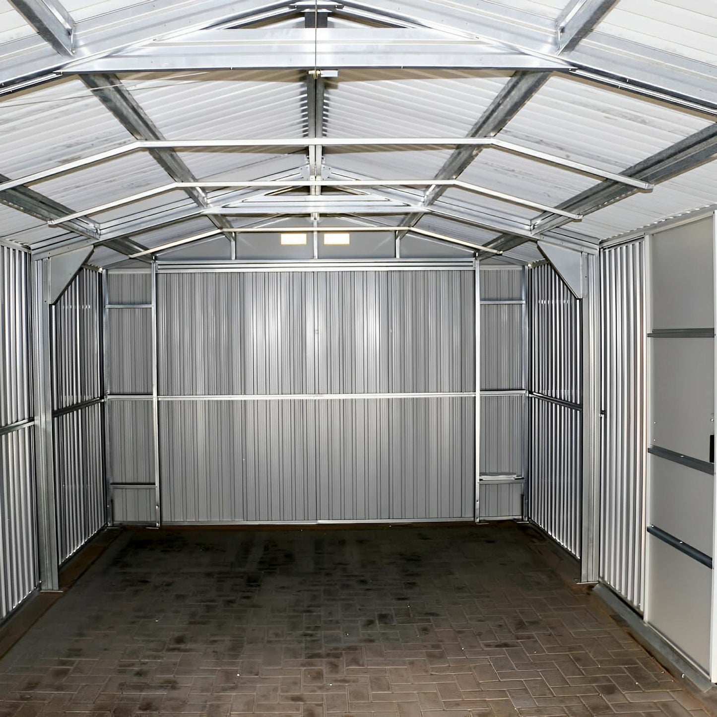 Interior view of Duramax 12x20 Imperial Metal Garage in dark gray, showcasing steel structure and spacious design.