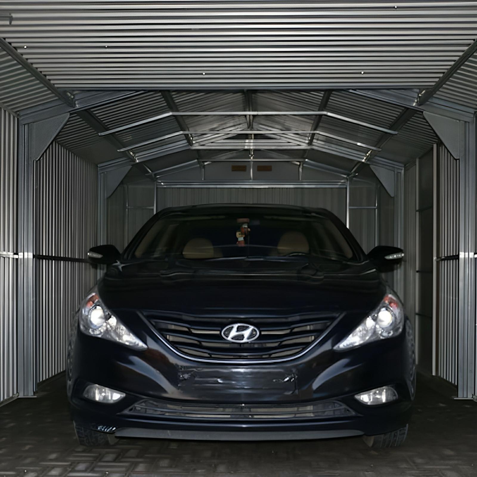 Duramax Imperial Metal Garage interior with car, showcasing robust steel construction and durability.