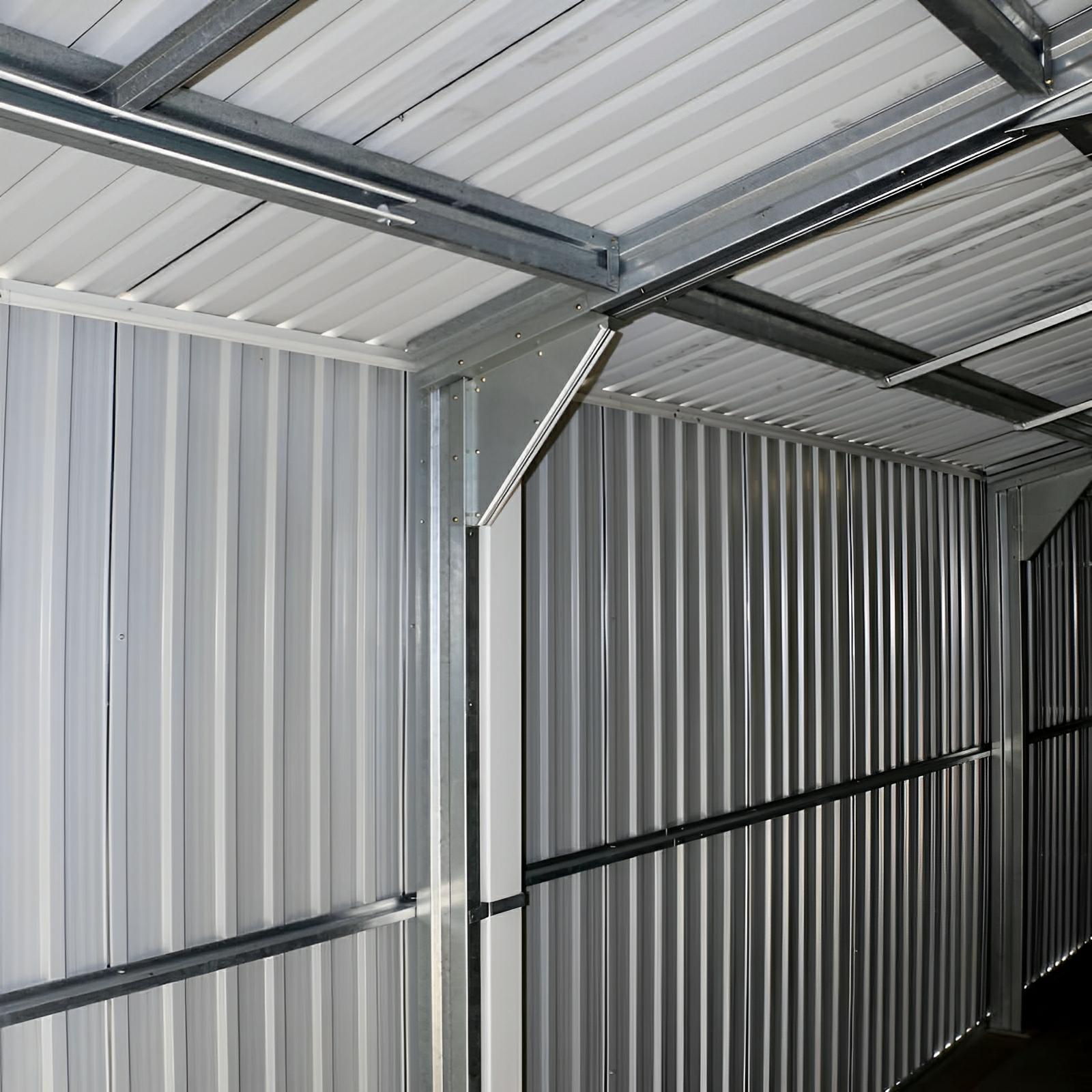 Interior view of Duramax Imperial Metal Garage showcasing sturdy steel construction and roofing support structure for durability.