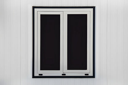 Double-pane window on a Duramax insulated shed showcasing robust construction and energy efficiency.