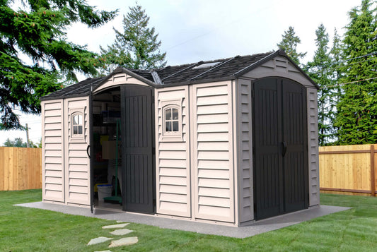 Duramax Sheds 15x8 Apex Pro Vinyl Shed with double doors and foundation in a garden setting 