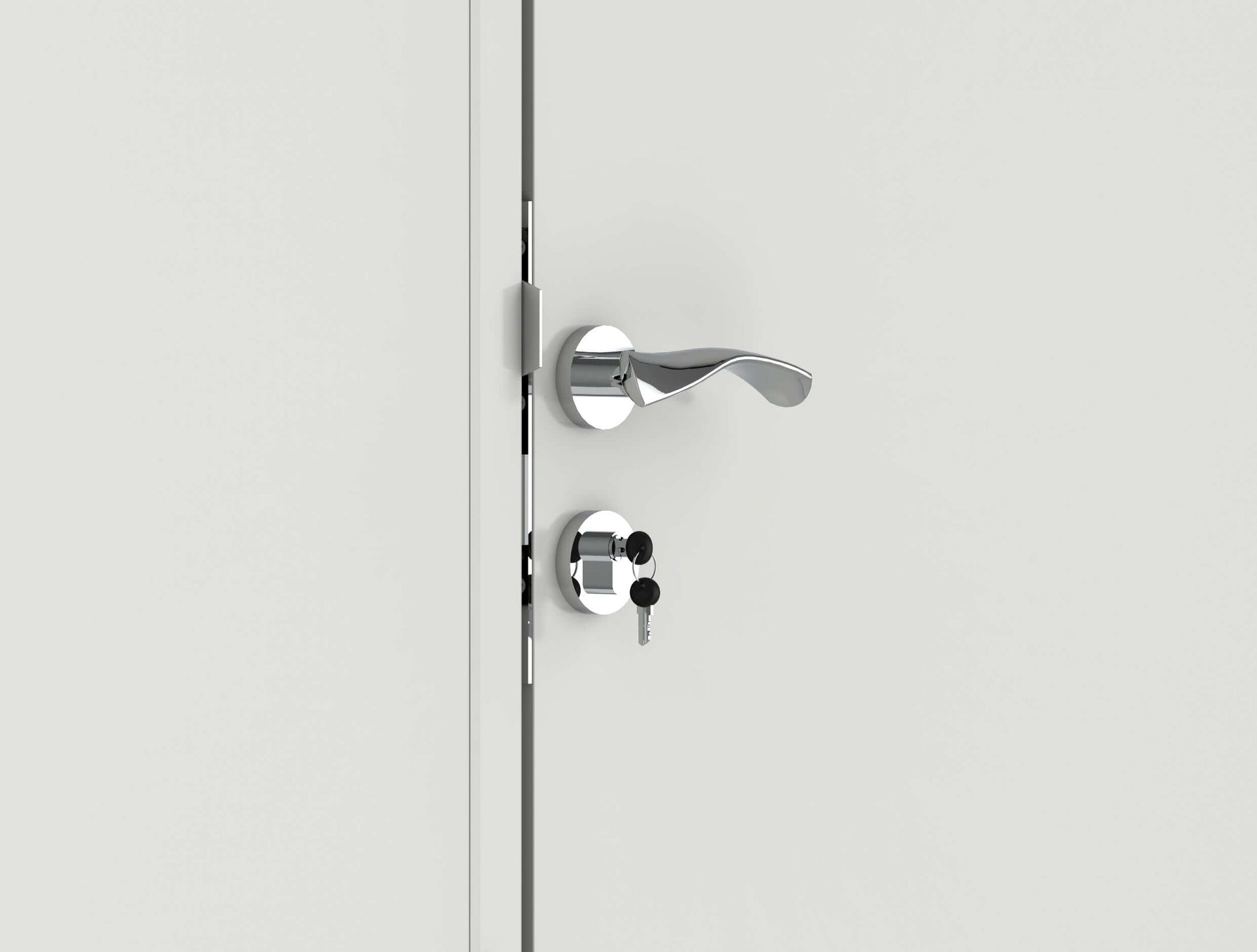 Close-up of a modern silver door handle with a key inserted in the lock.