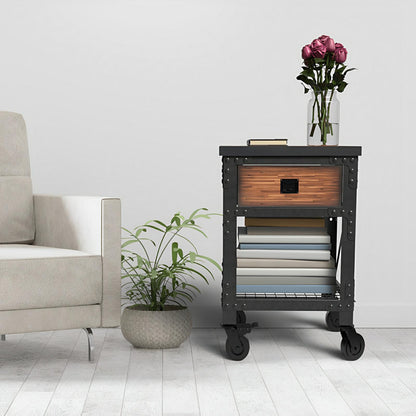 Duramax 1-drawer rolling industrial workbench with books and plant next to a sofa in a modern living space.