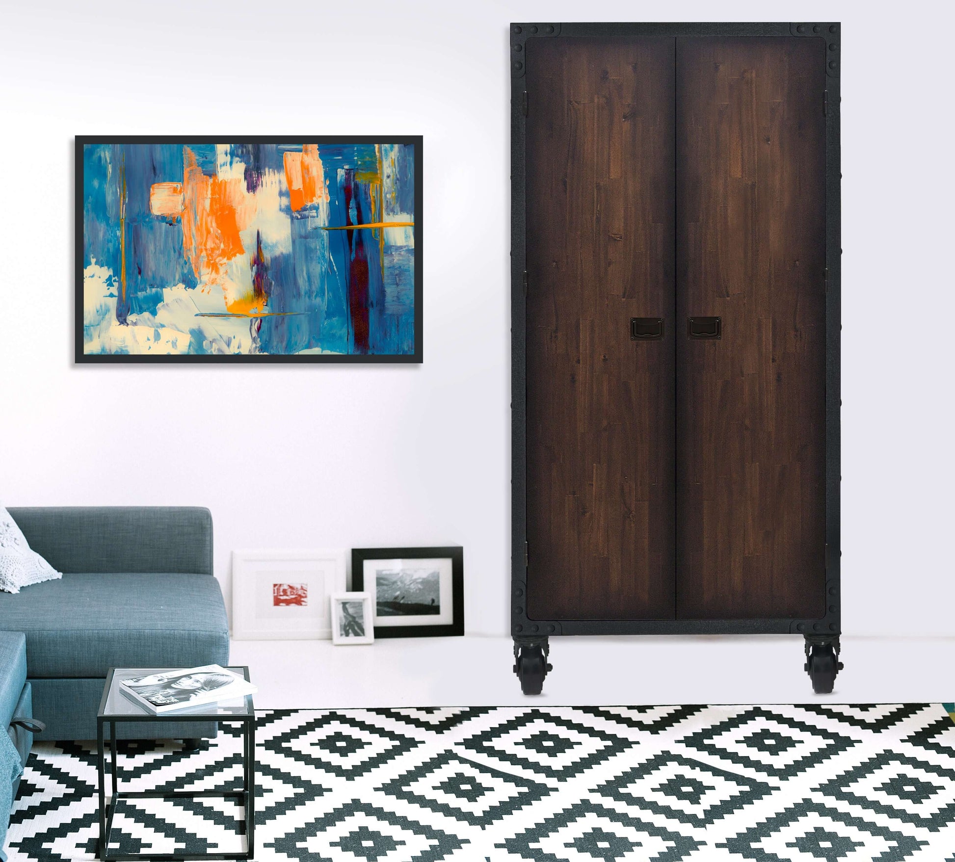 Industrial-style Duramax 36x72 cabinet with wheels in a modern living room, featuring wood and metal design and abstract wall art.