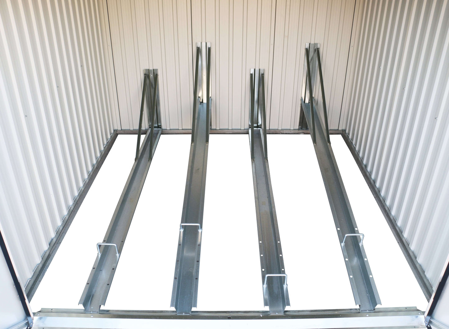 Interior view of the Duramax 6x6 Bike Shed 73051 showing sturdy metal construction and storage racks. Keywords: Duramax sheds, Duramax shed.