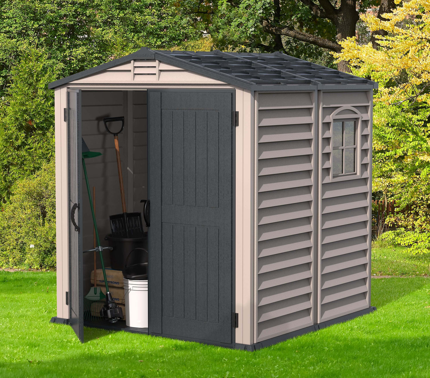 Duramax 6x6 StoreMate PLUS vinyl shed with open doors showing organized garden tools inside, ideal outdoor storage solution.