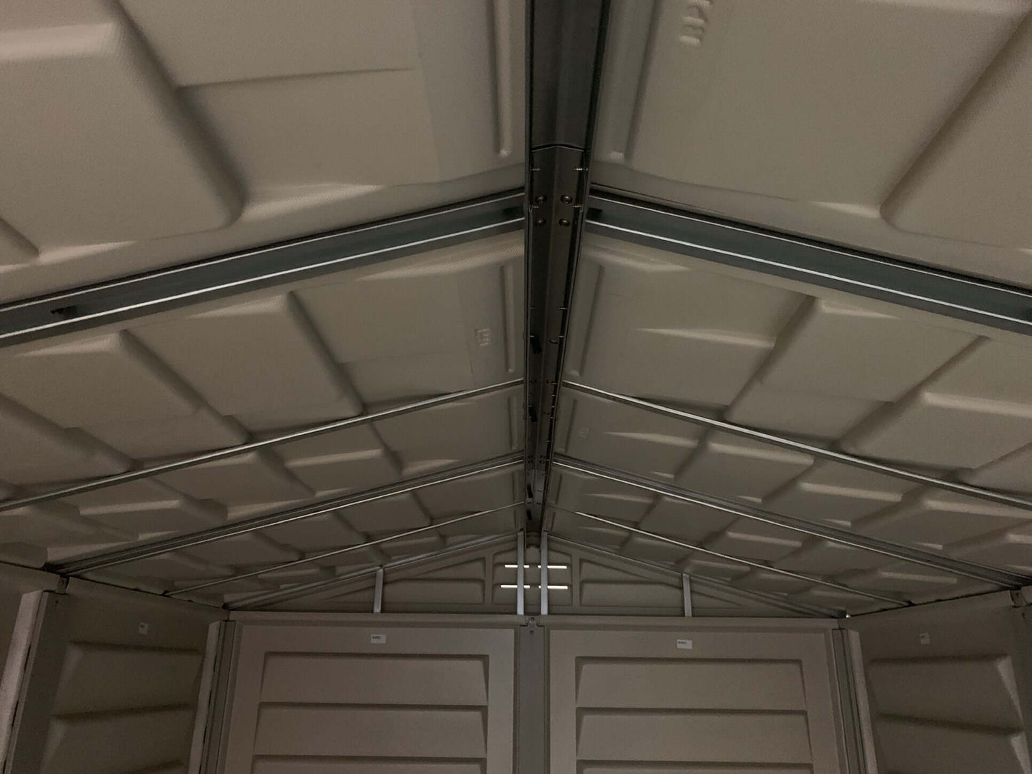 Interior view of Duramax StoreMate PLUS 6x6 vinyl shed with durable galvanized steel beams.
