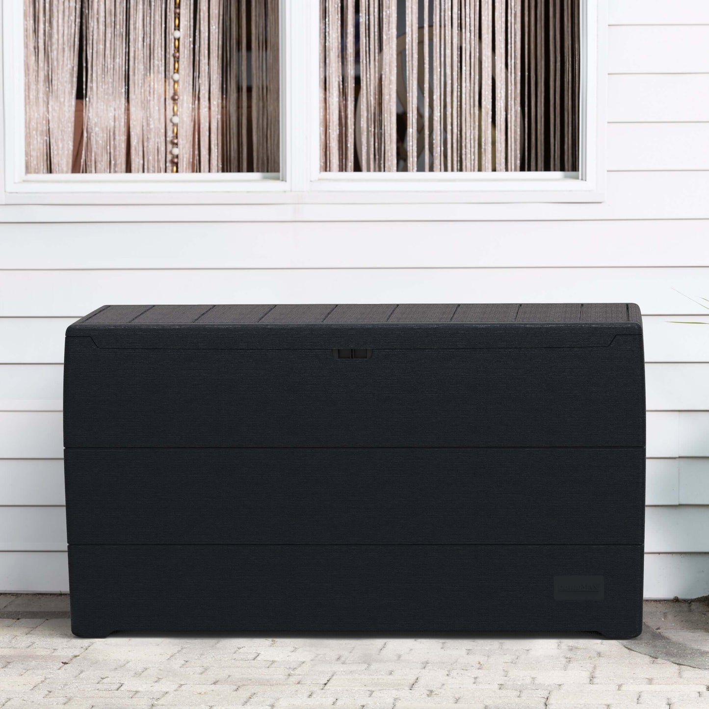 Duramax 71 Gallon Deck Box Gray in outdoor setting, offering sleek storage and seating with natural wood-like appearance.
