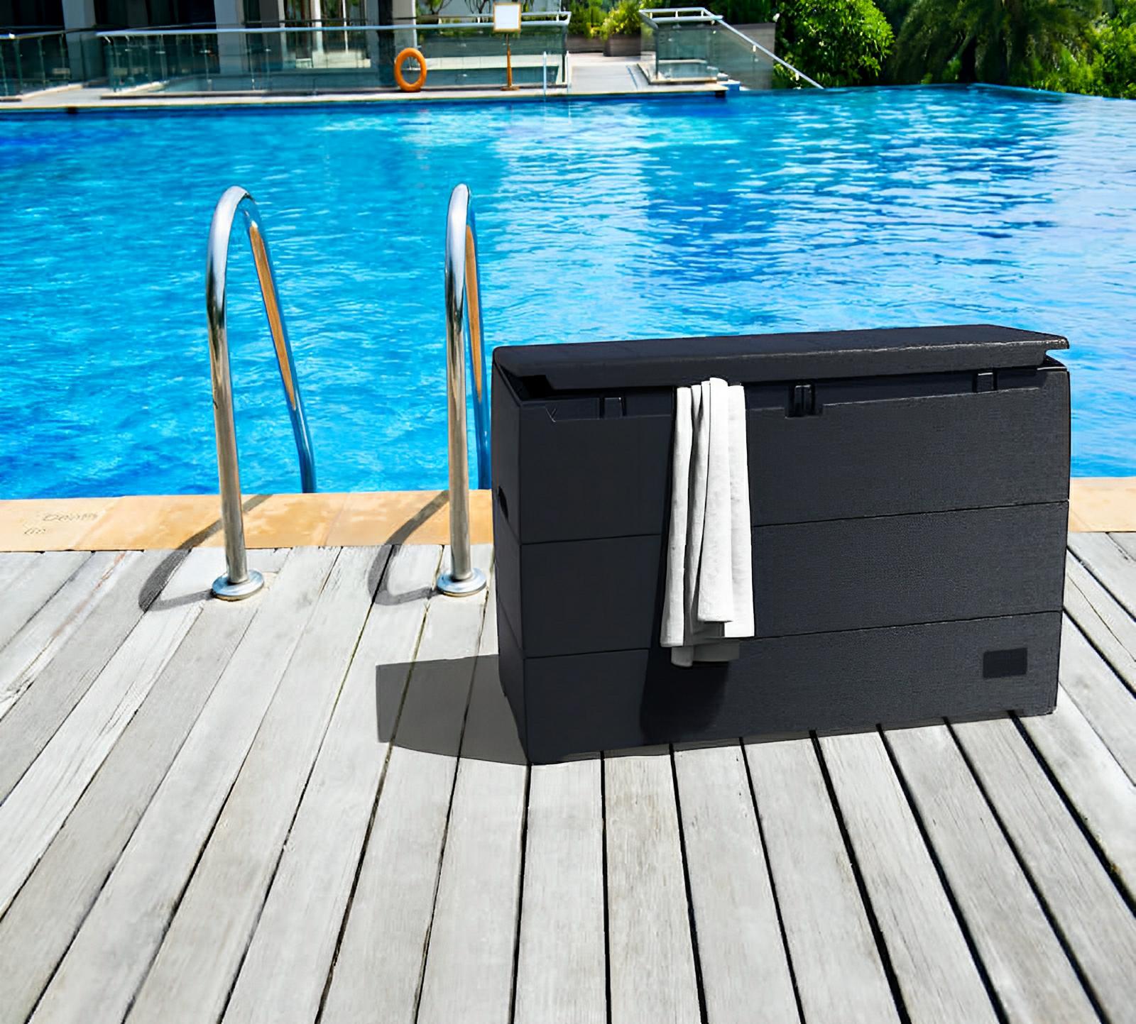 Duramax 71 Gallon Deck Box by pool, gray, perfect for outdoor storage and seating, stylish wood-like design.