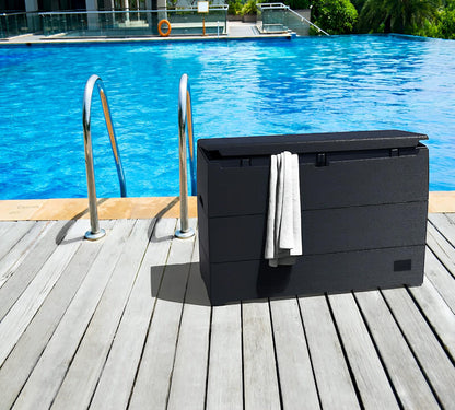 Duramax 71 Gallon Deck Box by pool, gray, perfect for outdoor storage and seating, stylish wood-like design.