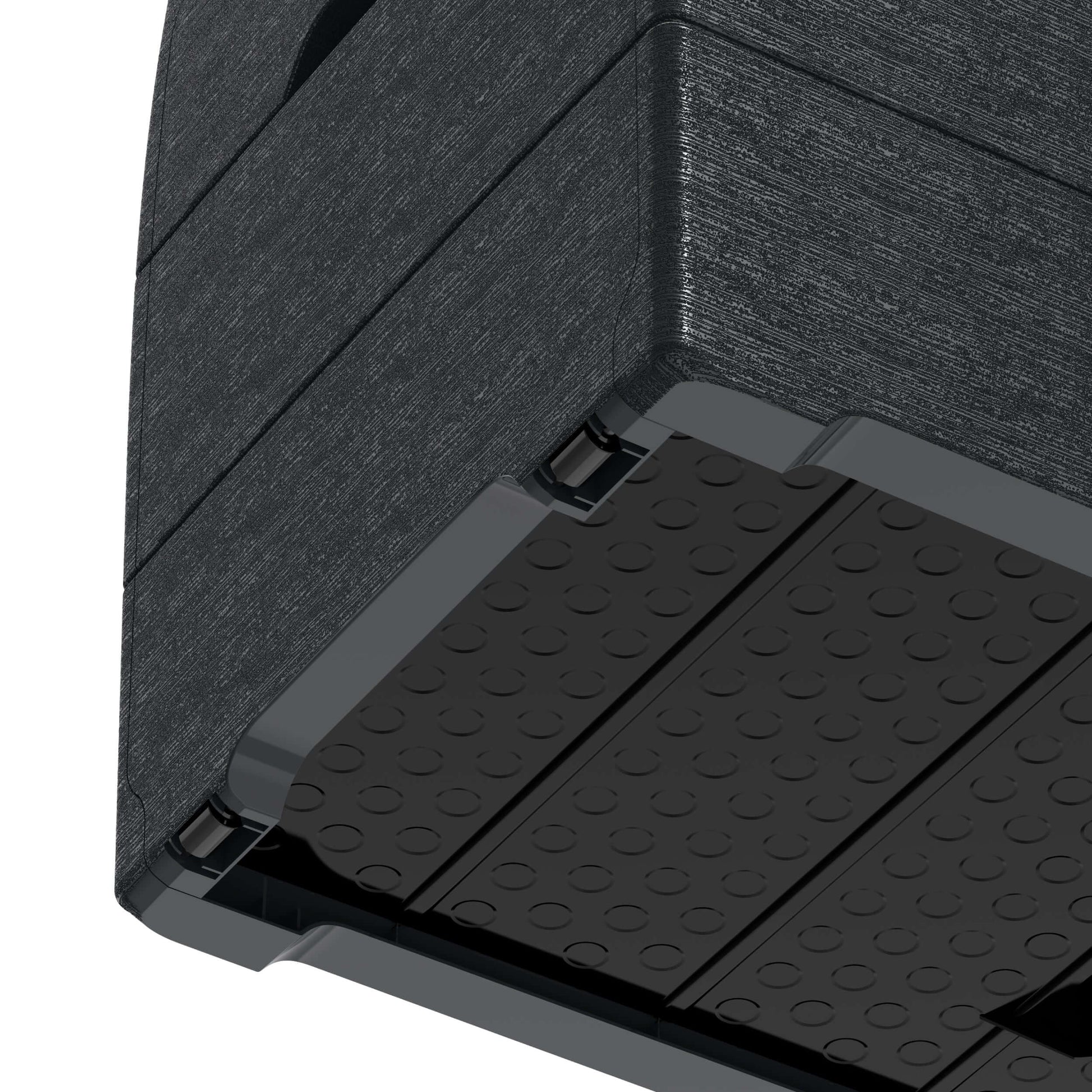 Close-up view of Duramax Deck Box bottom corner showing gray polypropylene resin texture and design detail.