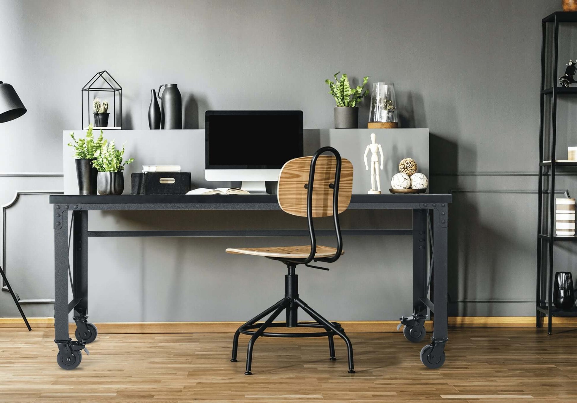 Duramax 72x24 industrial worktable with wooden top and metal frame, featuring swivel caster wheels in modern workspace.