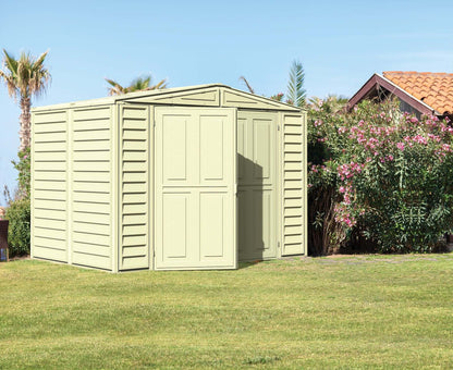 Duramax 8x6 DuraMate Vinyl Shed with Foundation in a garden setting, showcasing durable all-weather design for storage.
