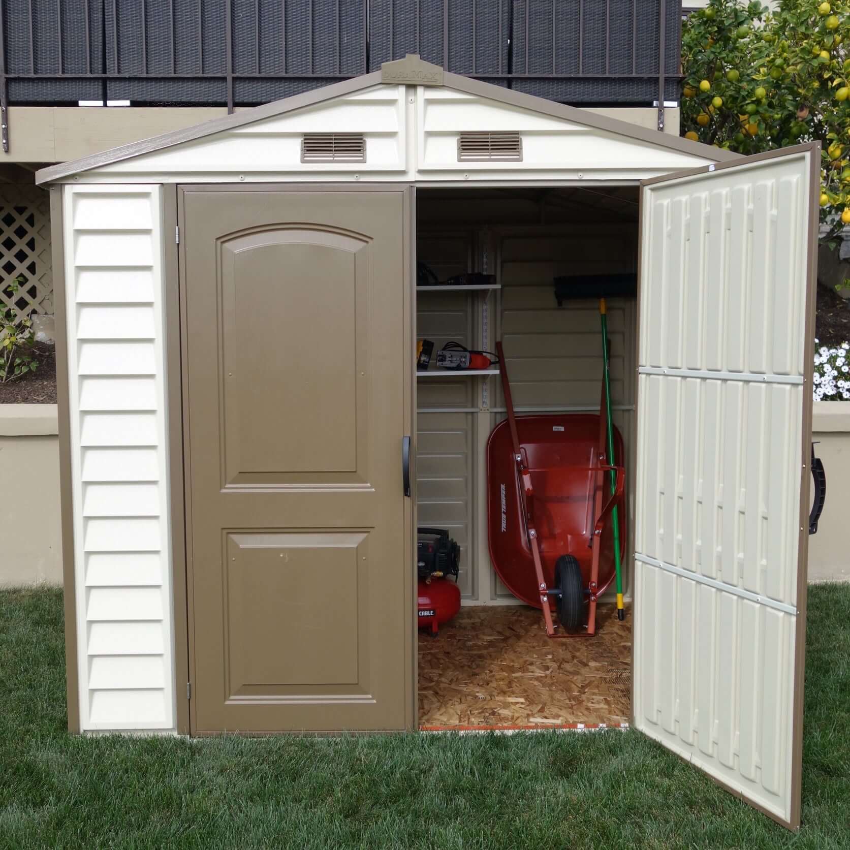 Duramax 8x6 StoreAll Vinyl Shed with open doors showing interior storage, ideal for outdoor use. Keywords: Duramax shed, Duramax Sheds.