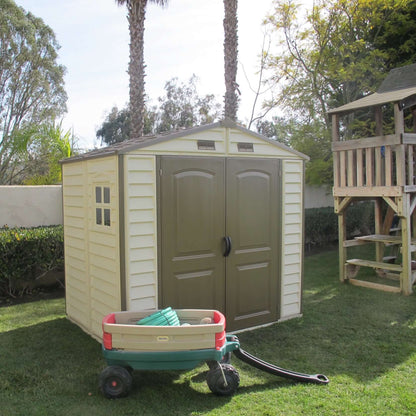 Duramax 8x6 StoreAll Vinyl Shed in backyard, ideal storage solution for families. Features reinforced metal columns. Duramax shed.