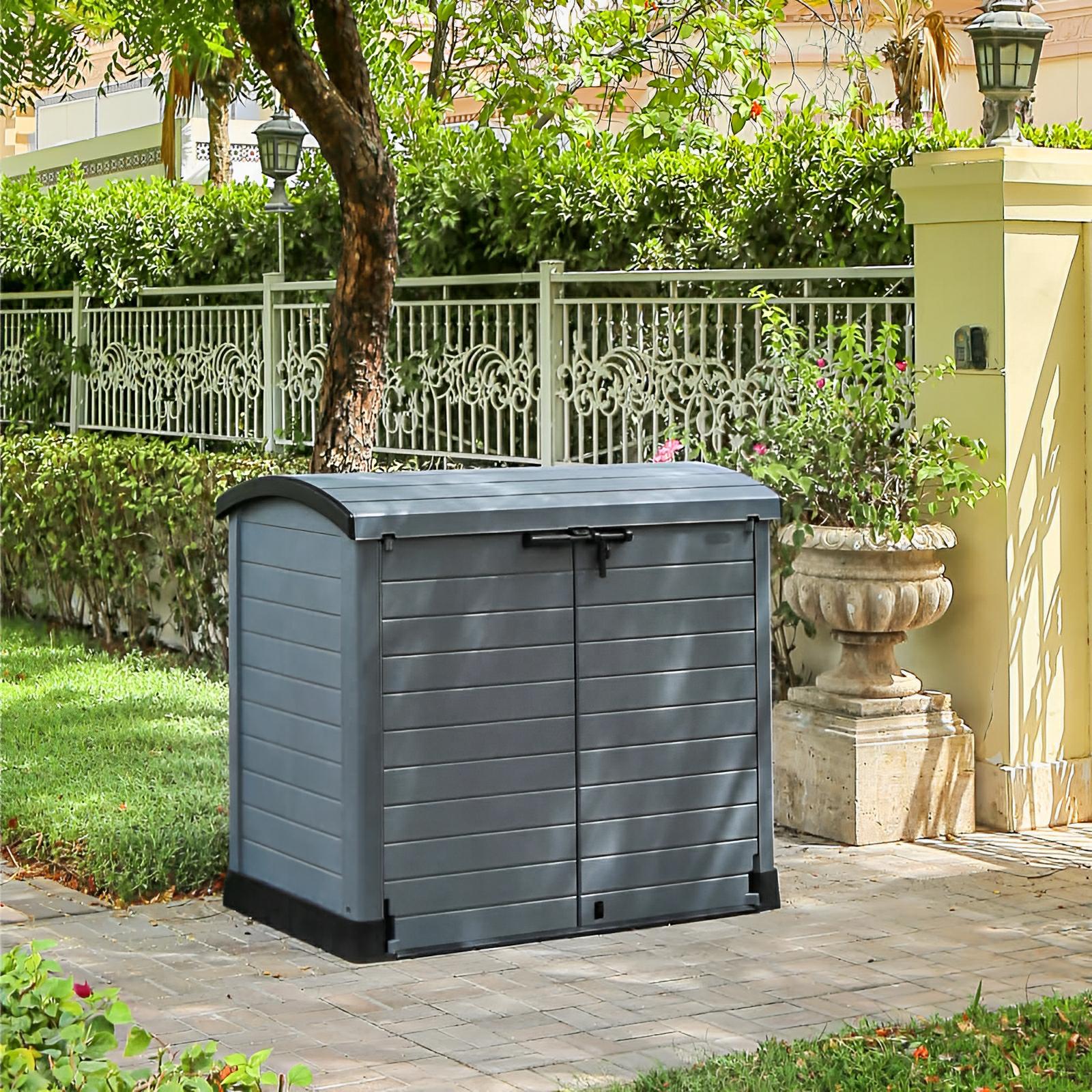 Gray Duramax StoreAway Arc Lid 1200L shed in garden; ideal for storing tools, bikes, barbecues; weatherproof, durable design.